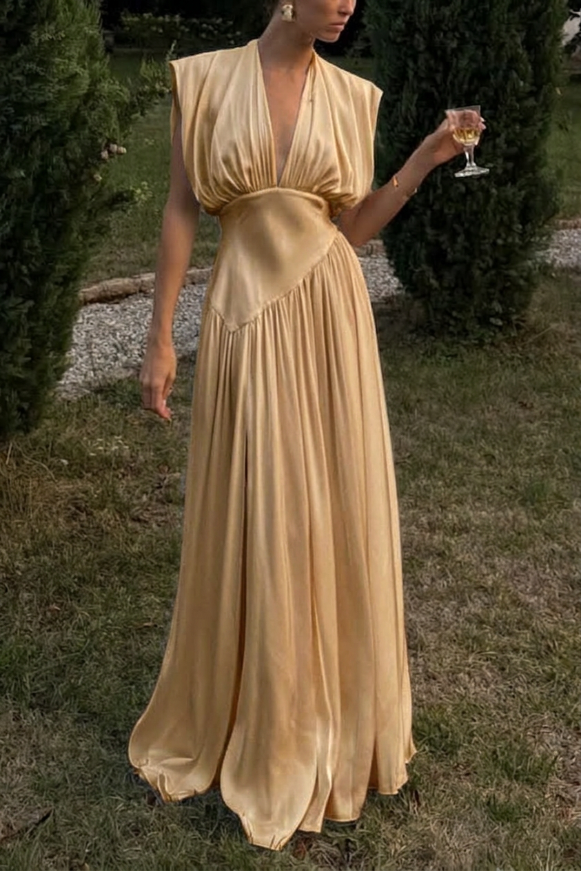 Golden champagne pleated satin gown with deep V neckline